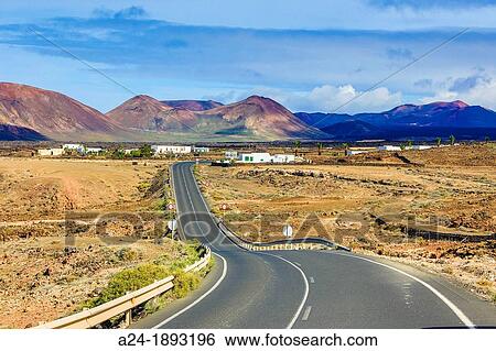 Spain, Canary Islands, Lanzarote Island, road at Timanfaya national Park View Large Photo Image Stock Photograph - Spain, Canary Islands, Lanzarote Island, road at Timanfaya national Park. Fotosearch