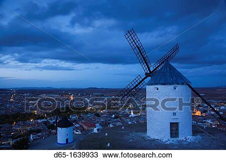 Spain, Castile-La Mancha Region, Toledo Province, La Mancha Area, Consuegra, antique La Mancha windmills and elevated town view, dusk View Large Photo Image Stock Image - Spain, Castile-La Mancha Region, Toledo Province, La Mancha Area, Consuegra, antique La Mancha windmills and elevated town view, dusk. Fotosearch