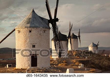 Spain, Castile-La Mancha Region, Toledo Province, La Mancha Area, Consuegra, antique La Mancha windmills, late afternoon View Large Photo Image Stock Photography - Spain, Castile-La Mancha Region, Toledo Province, La Mancha Area, Consuegra, antique La Mancha windmills, late afternoon. Fotosearch