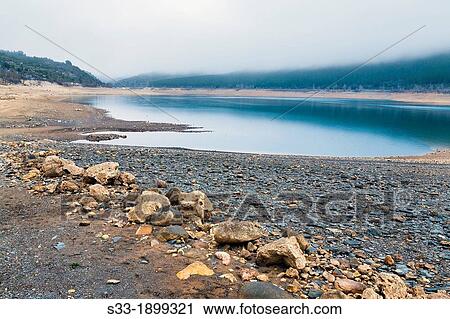 Spain, Castilla la Mancha, Guadalajara province, Sierra Norte, Scenic landscape of Belena reservoir View Large Photo Image Stock Image - Spain, Castilla la Mancha, Guadalajara province, Sierra Norte, Scenic landscape of Belena reservoir. Fotosearch