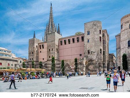 Spain, Catalonia, Barcelona, Barri G? tic, view Pla? a Nova with Barcelona Cathedral, the Romanesque towers and the Portal del Bisbe, which was once the principal gateway in Roman Barcelona's city walls. View Large Photo Image Picture - Spain, Catalonia, Barcelona, Barri G? tic, view Pla? a Nova with Barcelona Cathedral, the Romanesque towers and the Portal del Bisbe, which was once the principal gateway in Roman Barcelona's city walls.. Fotosearch