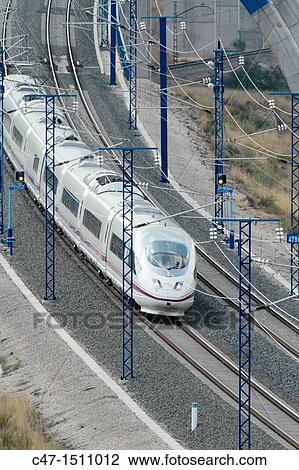 Stock Image - Spain, Catalonia, Lleida province, High Speed train, AVE Series 103 taken at Vinaixa viaduct The Vinaixa viaduct if 1044 meters long, 22 pilars and two arc pilars of 41 by 24 meters allowing conventional trains circulating underneath. Fotosearch