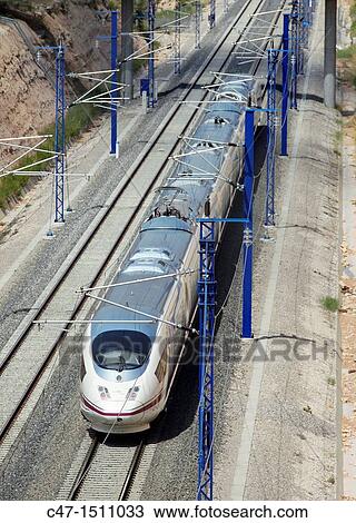 Spain, Catalonia, Lleida province, High Speed train, AVE Series 103 taken near Vinaixa viaduct View Large Photo Image Stock Image - Spain, Catalonia, Lleida province, High Speed train, AVE Series 103 taken near Vinaixa viaduct. Fotosearch