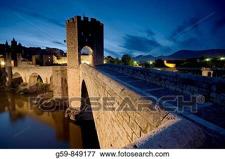 Stock Photo - Spain, Catalunia Catalunya, Besalu, Pont Vell Old Bridge over Fluvia River. Fotosearch