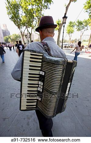 Stock Photograph - Spain, Catalunya, Barcelona, Las Ramblas, Street musician. Fotosearch