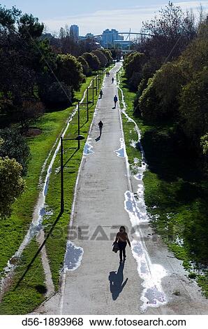Spain, Comunidad Valenciana, Valencia, Path over old riverbed of Turia river View Large Photo Image Stock Photo - Spain, Comunidad Valenciana, Valencia, Path over old riverbed of Turia river. Fotosearch