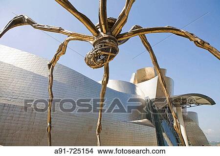 Spain, Euskadi, Biscaya, City of Bilbao, Guggenheim Museum built in 1997 by canadian architect Frank Gehry, sculpture? Maman? by Louise Bourgeois View Large Photo Image Picture - Spain, Euskadi, Biscaya, City of Bilbao, Guggenheim Museum built in 1997 by canadian architect Frank Gehry, sculpture? Maman? by Louise Bourgeois. Fotosearch