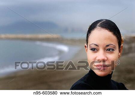 Stock Image - Spain, Malaga. Woman on beach. Fotosearch