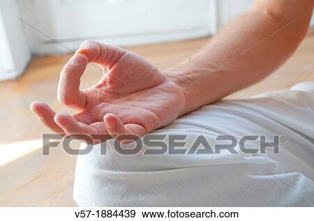 Spain, Man practicing yoga Asana, sitting in lotus position View Large Photo Image Stock Photo - Spain, Man practicing yoga Asana, sitting in lotus position. Fotosearch