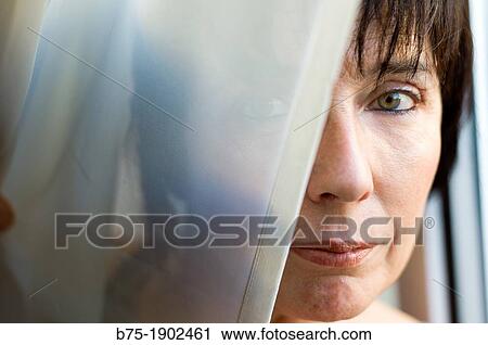 Spain, Portrait of mature woman behind veil View Large Photo Image Stock Image - Spain, Portrait of mature woman behind veil. Fotosearch