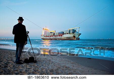 Spain, Valencia, El Saler, Photographer and Boat on Beach View Large Photo Image Stock Image - Spain, Valencia, El Saler, Photographer and Boat on Beach. Fotosearch