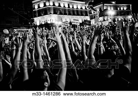 Spaniards flood Madrid's Puerta del Sol Square on regional and municipal pre-elections demonstrations View Large Photo Image Stock Photograph - Spaniards flood Madrid's Puerta del Sol Square on regional and municipal pre-elections demonstrations. Fotosearch