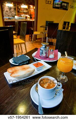 Spanish breakfast: toast with olive oil and tomato, orange juice and cup of coffee. View Large Photo Image Stock Image - Spanish breakfast: toast with olive oil and tomato, orange juice and cup of coffee.. Fotosearch