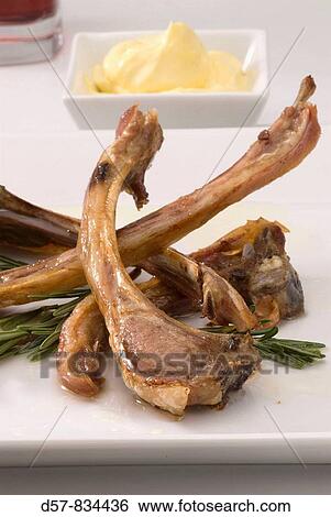 Stock Photograph - Spanish Cuisine Costillas de cordero Grilled lamb spares. Fotosearch