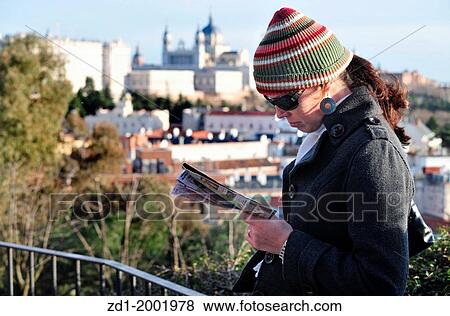 Spanish lady reading a map of Madrid at a lookout of the Royal Palace and Almudena Cathedral Madrid, Spain. View Large Photo Image Stock Photo - Spanish lady reading a map of Madrid at a lookout of the Royal Palace and Almudena Cathedral Madrid, Spain.. Fotosearch