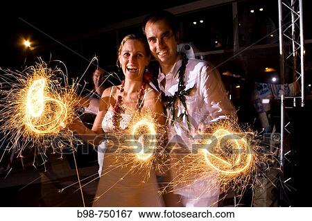 Sparklers used during wedding celebration View Large Photo Image Stock Photo - Sparklers used during wedding celebration. Fotosearch