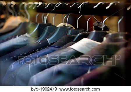 spars with mens suits in clothing process View Large Photo Image Stock Photo - spars with mens suits in clothing process. Fotosearch