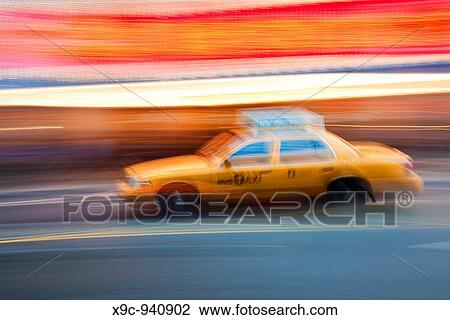 Stock Image - Speeding Taxi in New York. Fotosearch