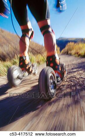 Stock Image - Speedskating team on gateskates in Park City. Utah. USA. Fotosearch