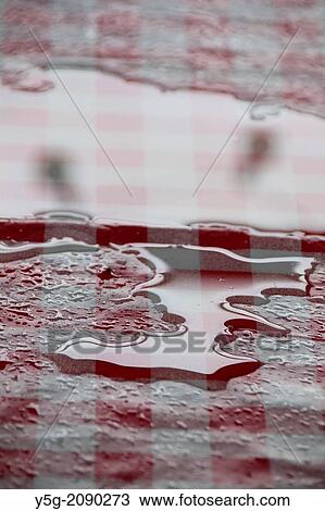 spilled water on plastic tablecloth outdoors View Large Photo Image Stock Image - spilled water on plastic tablecloth outdoors. Fotosearch