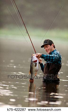Spinning rod, Largemouth Bass View Large Photo Image Stock Photo - Spinning rod, Largemouth Bass. Fotosearch