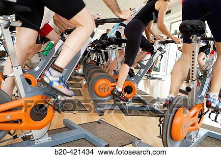 Spinning, training program for cardiovascular work and toning up in exercise bicycle. Real Club de Tenis de San SebastiBn, Gipuzkoa, Euskadi. View Large Photo Image Picture - Spinning, training program for cardiovascular work and toning up in exercise bicycle. Real Club de Tenis de San SebastiBn, Gipuzkoa, Euskadi.. Fotosearch