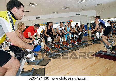 Stock Image - Spinning, training program for cardiovascular work and toning up in exercise bicycle. Real Club de Tenis de San SebastiBn, Gipuzkoa, Euskadi.. Fotosearch