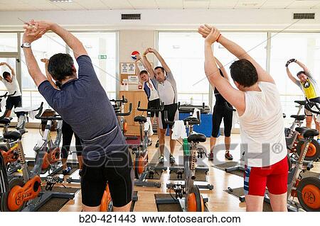 Stock Image - Spinning, training program for cardiovascular work and toning up in exercise bicycle. Real Club de Tenis de San SebastiBn, Gipuzkoa, Euskadi.. Fotosearch