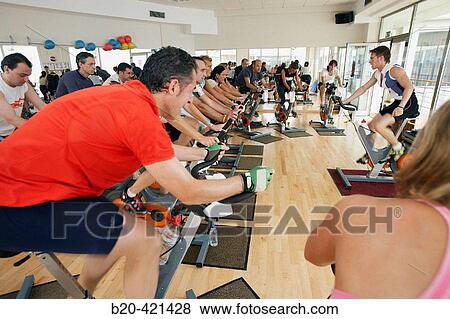 Spinning, training program for cardiovascular work and toning up in exercise bicycle. Real Club de Tenis de San SebastiBn, Gipuzkoa, Euskadi. View Large Photo Image Stock Photo - Spinning, training program for cardiovascular work and toning up in exercise bicycle. Real Club de Tenis de San SebastiBn, Gipuzkoa, Euskadi.. Fotosearch