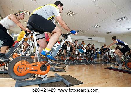 Spinning, training program for cardiovascular work and toning up in exercise bicycle. Real Club de Tenis de San SebastiBn, Gipuzkoa, Euskadi. View Large Photo Image Stock Photo - Spinning, training program for cardiovascular work and toning up in exercise bicycle. Real Club de Tenis de San SebastiBn, Gipuzkoa, Euskadi.. Fotosearch