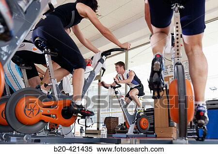 Stock Photography - Spinning, training program for cardiovascular work and toning up in exercise bicycle. Real Club de Tenis de San SebastiBn, Gipuzkoa, Euskadi.. Fotosearch