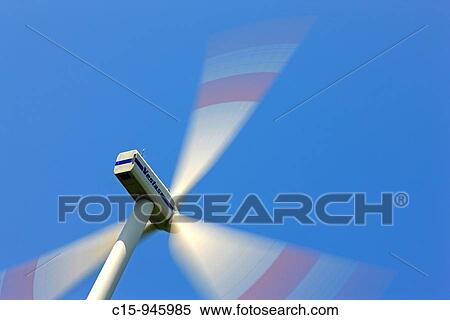 Spinning Wind turbine generator against blue sky View Large Photo Image Stock Photography - Spinning Wind turbine generator against blue sky. Fotosearch