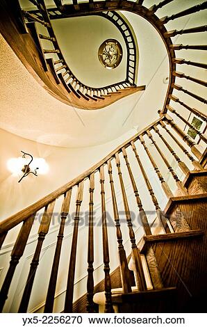 Stock Image - Spiral staircase in a family house.. Fotosearch