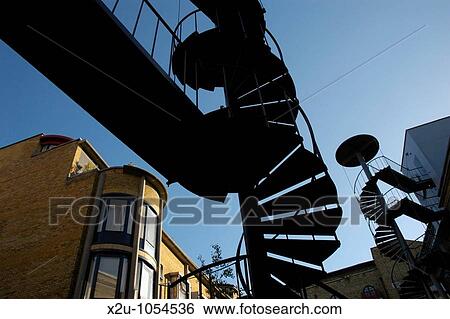 Spiral staircases in Brewery Square near Butler Wharf, London, England View Large Photo Image Stock Photograph - Spiral staircases in Brewery Square near Butler Wharf, London, England. Fotosearch