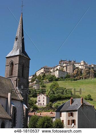 SPIRE OF CHURCH OF SAINT CHRISTINE LOWER TOWN SAINT FLOUR CANTAL AUVERGNE FRANCE View Large Photo Image Stock Photo - SPIRE OF CHURCH OF SAINT CHRISTINE LOWER TOWN SAINT FLOUR CANTAL AUVERGNE FRANCE. Fotosearch