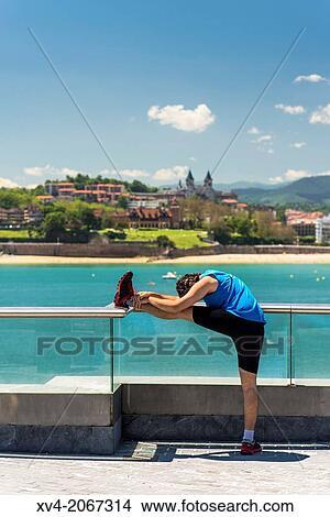 Sportmen at old port of San Sebastian, Basque Country, Spain. View Large Photo Image Picture - Sportmen at old port of San Sebastian, Basque Country, Spain.. Fotosearch