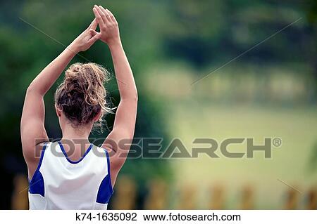 sports playing girl with arms raised, shot from behind View Large Photo Image Stock Image - sports playing girl with arms raised, shot from behind. Fotosearch