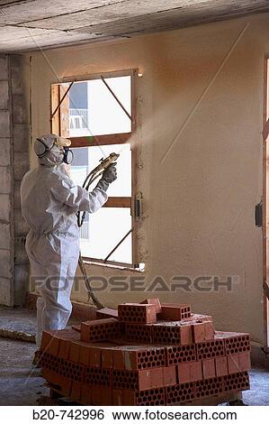 Spraying polyurethane foam, thermal and acoustic insulation, housing under construction. Donostia, Gipuzkoa, Basque Country, Spain View Large Photo Image Stock Photograph - Spraying polyurethane foam, thermal and acoustic insulation, housing under construction. Donostia, Gipuzkoa, Basque Country, Spain. Fotosearch