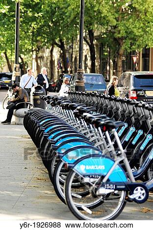 Spring street scene in Northumberland Avenue near Trafalgar Square in London, England, UK, with Boris Bikes in the foreground View Large Photo Image Stock Photo - Spring street scene in Northumberland Avenue near Trafalgar Square in London, England, UK, with Boris Bikes in the foreground. Fotosearch