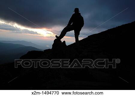 Ssilhouette of rock cairn and hiker along the Appalachian Trail near Mount Clay in the White Mountains, New Hampshire USA during the summer months View Large Photo Image Stock Image - Ssilhouette of rock cairn and hiker along the Appalachian Trail near Mount Clay in the White Mountains, New Hampshire USA during the summer months. Fotosearch