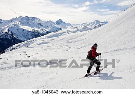 Stock Image - St Anton am Arlberg, Tyrol, Austria, Europe Skier on ski route 33 from Kapall in Austrian Alps MR 11/04. Fotosearch