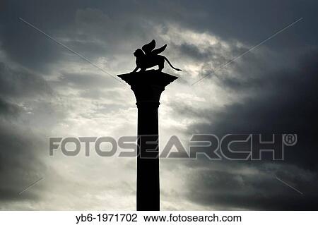 St. Mark's Winged lion column in St. Mark's Square, Venice, Italy. View Large Photo Image Stock Image - St. Mark's Winged lion column in St. Mark's Square, Venice, Italy.. Fotosearch