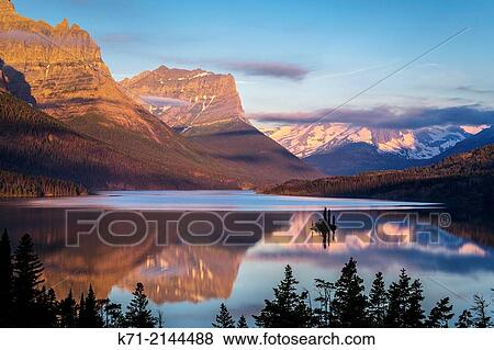 St. Mary Lake and Wild Goose Island at sunrise in Glacier National Park, Montana, USA. View Large Photo Image Stock Photo - St. Mary Lake and Wild Goose Island at sunrise in Glacier National Park, Montana, USA.. Fotosearch