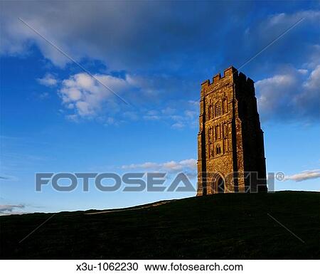 St Michaels Tower on the top of Glastonbury Tor at sunset, Glastonbury, Somerset, England, United Kingdom View Large Photo Image Stock Image - St Michaels Tower on the top of Glastonbury Tor at sunset, Glastonbury, Somerset, England, United Kingdom. Fotosearch