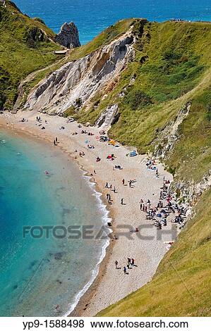 Stock Photo - St Oswald's Bay, also known as Man O? War Cove, in Dorset, England. Fotosearch