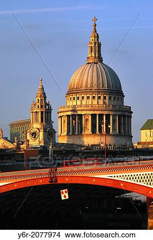St. Paul's Cathedral in the heart of London, England, with Blackfriar's Bridge over the River Thames in the foreground, lit up by warm late evening light. View Large Photo Image Picture - St. Paul's Cathedral in the heart of London, England, with Blackfriar's Bridge over the River Thames in the foreground, lit up by warm late evening light.. Fotosearch