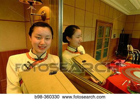 St. Regis Hotel's Chinese restaurant: waitress in traditional clothes. Beijing. China View Large Photo Image Stock Image - St. Regis Hotel's Chinese restaurant: waitress in traditional clothes. Beijing. China. Fotosearch