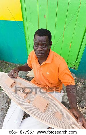 Stock Photo - St Vincent and the Grenadines, Bequia, Port Elizabeth, Mauvins Model Boat Shop, model maker, R, MR-SVG-12-001. Fotosearch