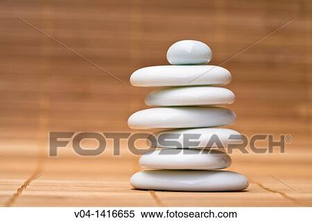 Stack of balanced white pebbles View Large Photo Image Stock Photography - Stack of balanced white pebbles. Fotosearch