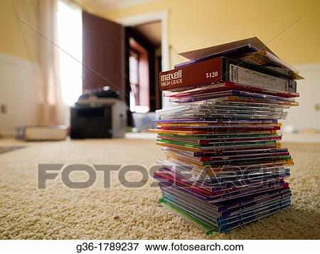 Stock Photo - Stack of cds on floor in messy-room inside of a foreclosed home in Talahassee, Florida, United States. Fotosearch